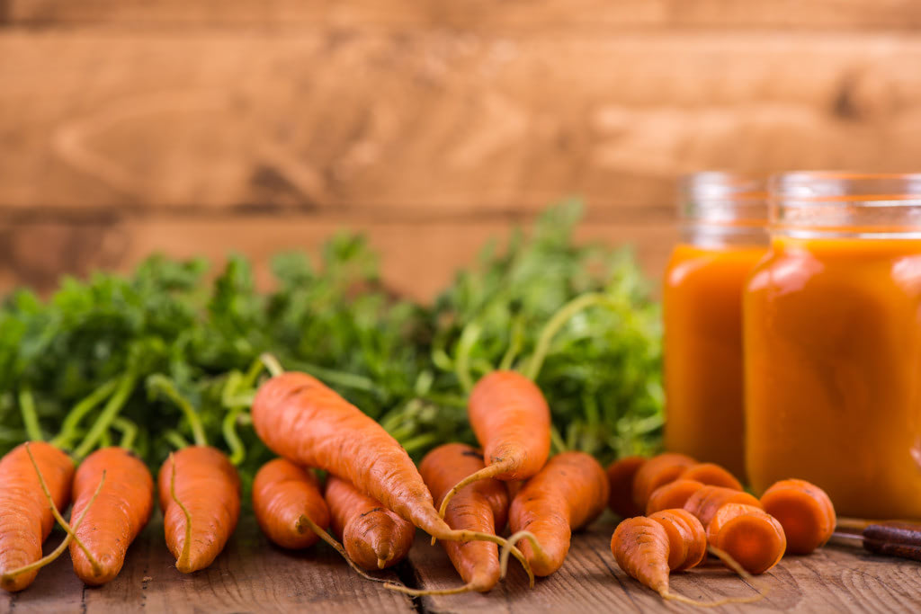 fresh carrot juice, food background